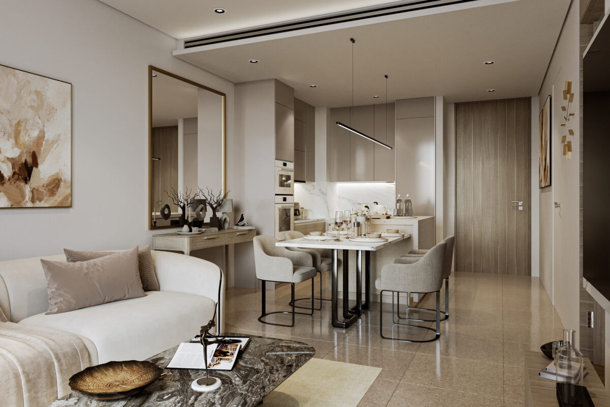 A modern and elegantly designed apartment in Dubai, showcasing the high-quality living spaces offered by Investing in Mirha Homes Development. The open-plan layout features a stylish living area with a cozy sofa, a marble coffee table, and neutral-toned décor. The dining space includes a sleek table with four upholstered chairs, seamlessly connected to a contemporary kitchen with built-in appliances and soft-close cabinets. Warm lighting, gold accents, and wellness-inspired interiors enhance the luxurious feel, making this an attractive choice for investors seeking premium real estate opportunities in Dubai.